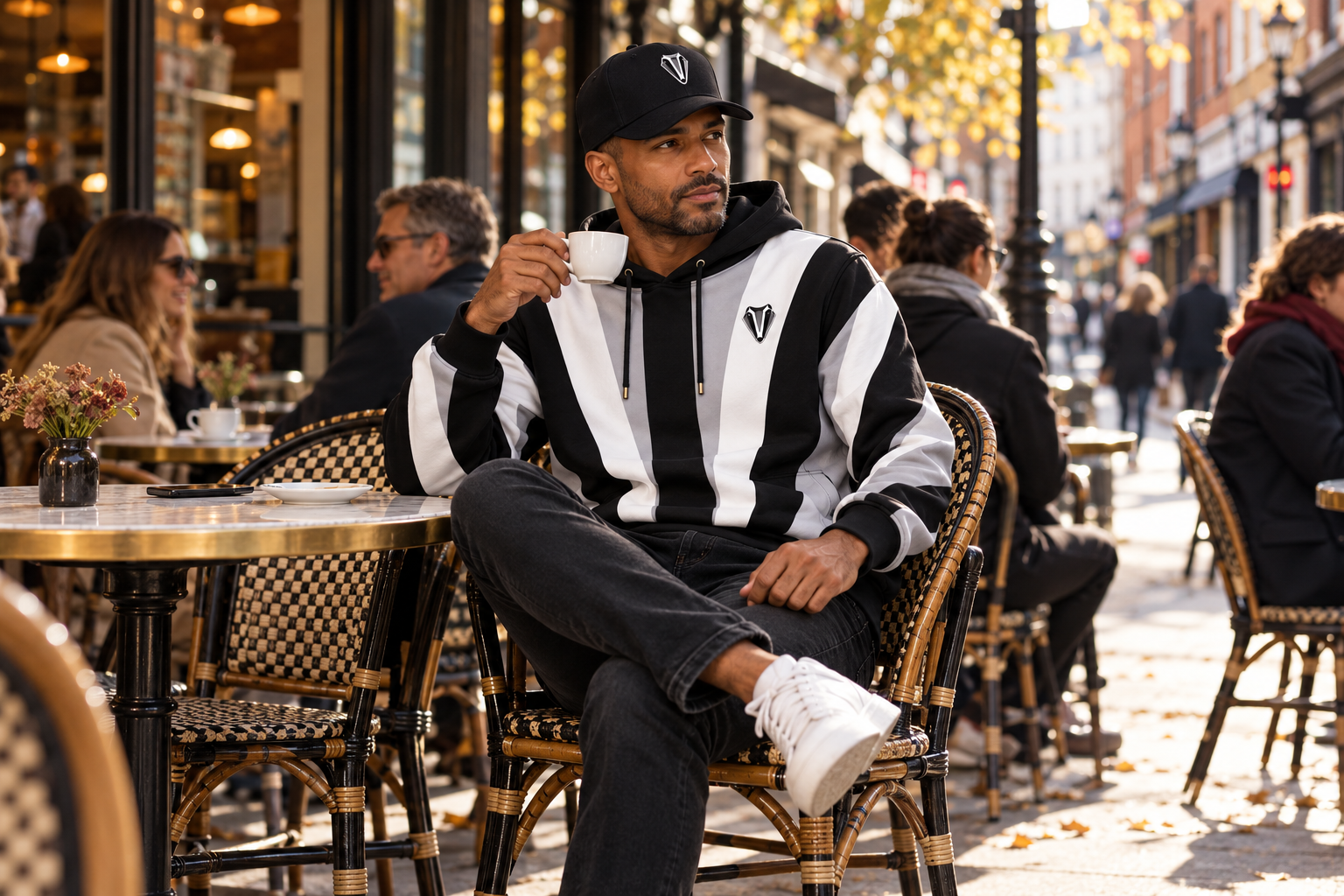 BE BADger clothing worn at café terrace in Paris